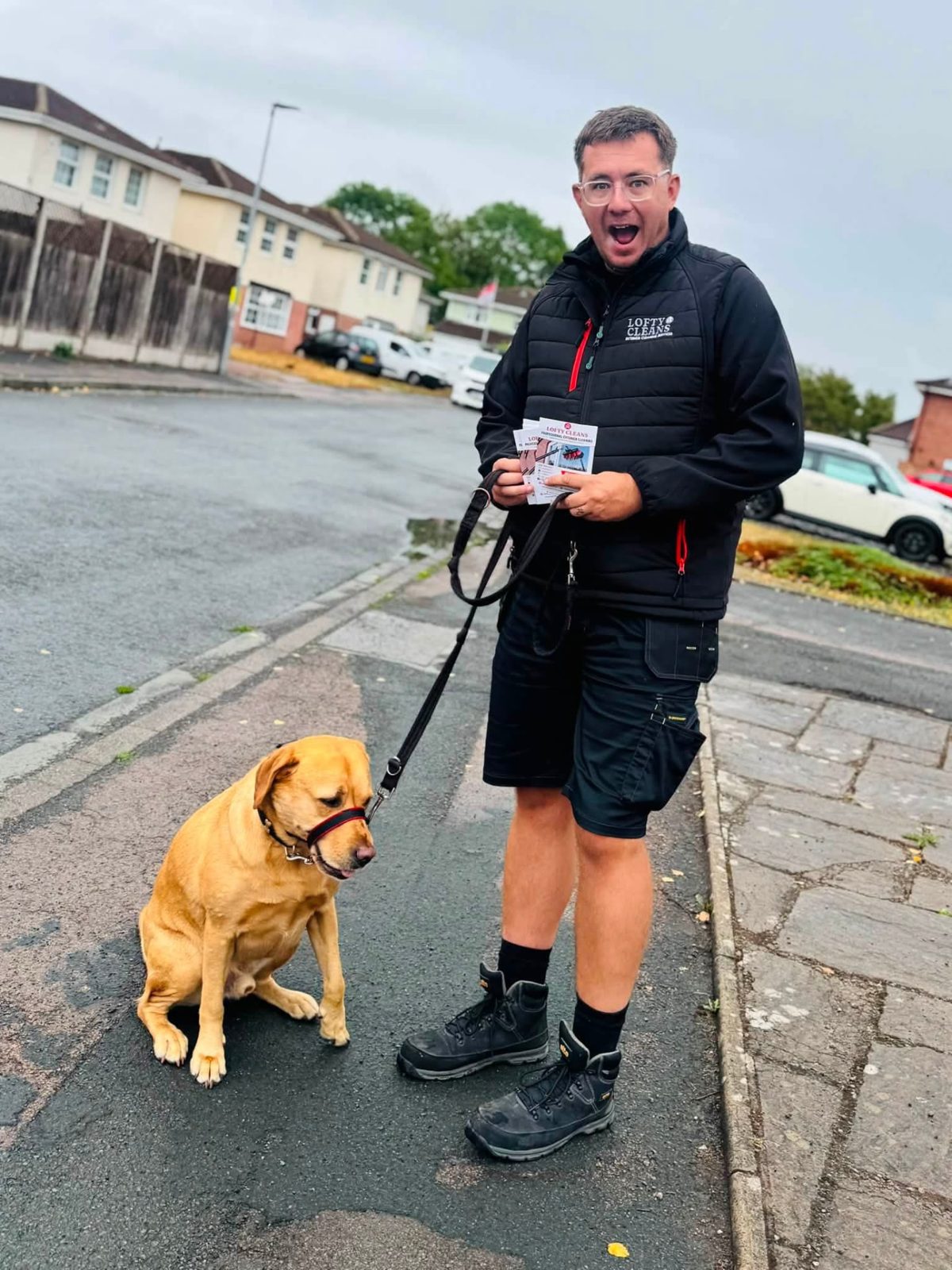 The Lofty Cleans team out delivering leaflets with the company dog